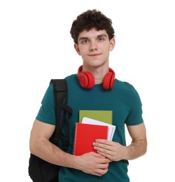 Photo of Portrait of student with backpack, notebooks and headphones on white background