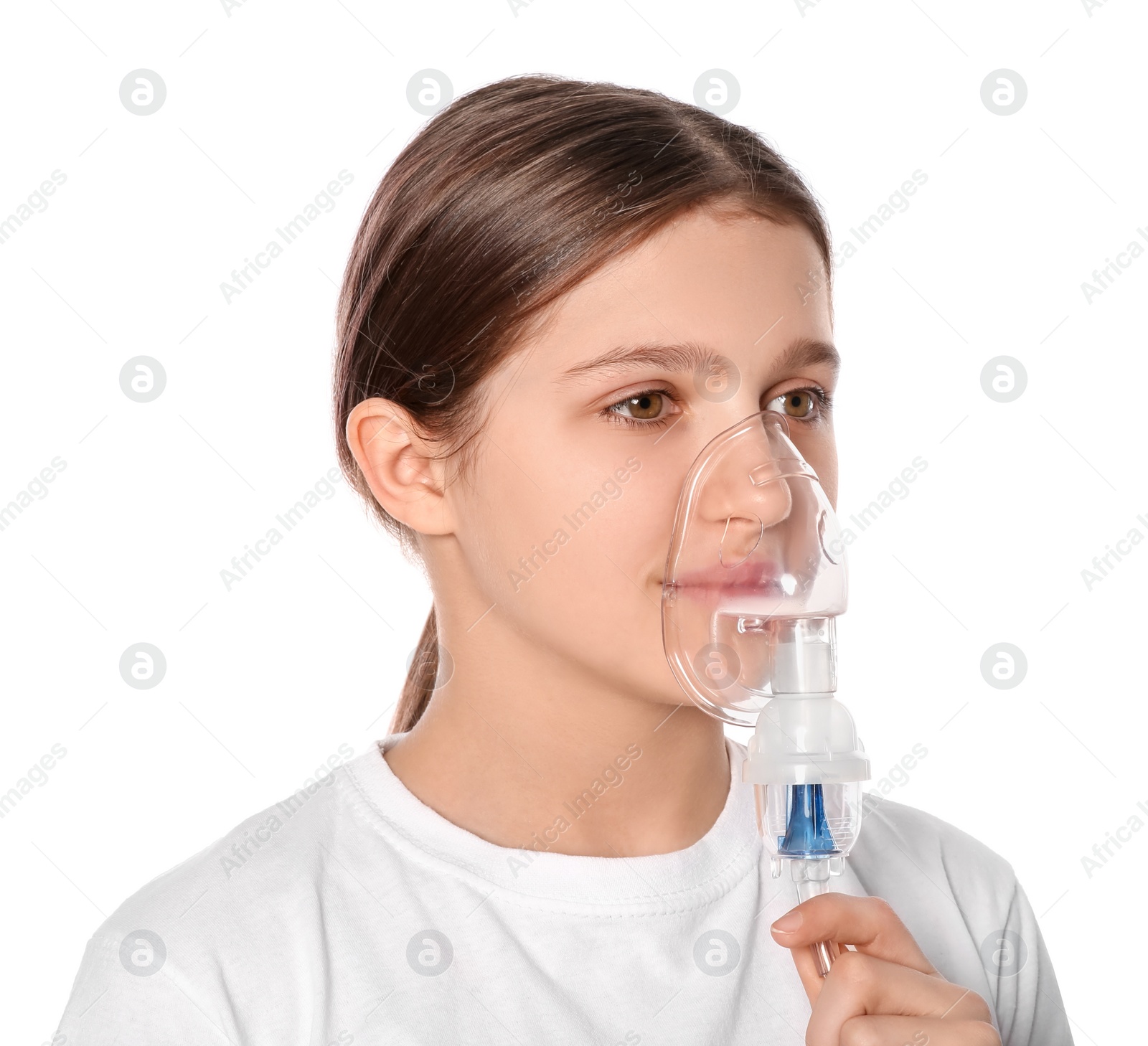 Photo of Cute girl using nebulizer for inhalation on white background