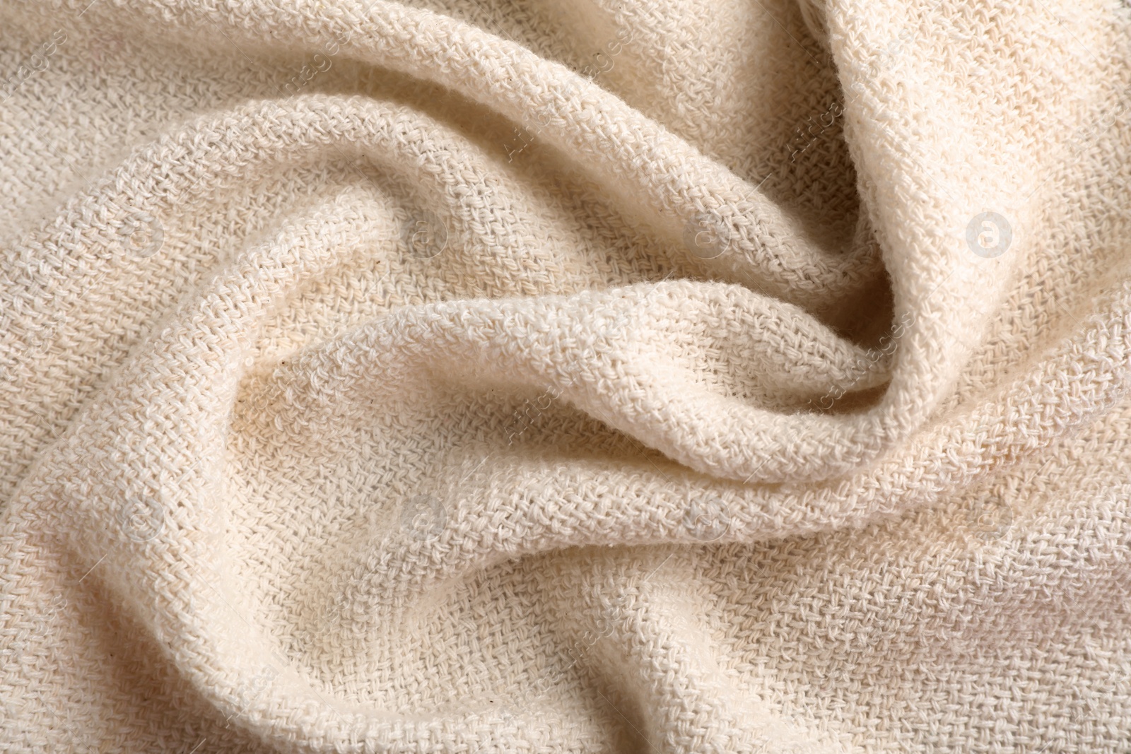 Photo of Beige hemp cloth as background, top view. Natural fabric