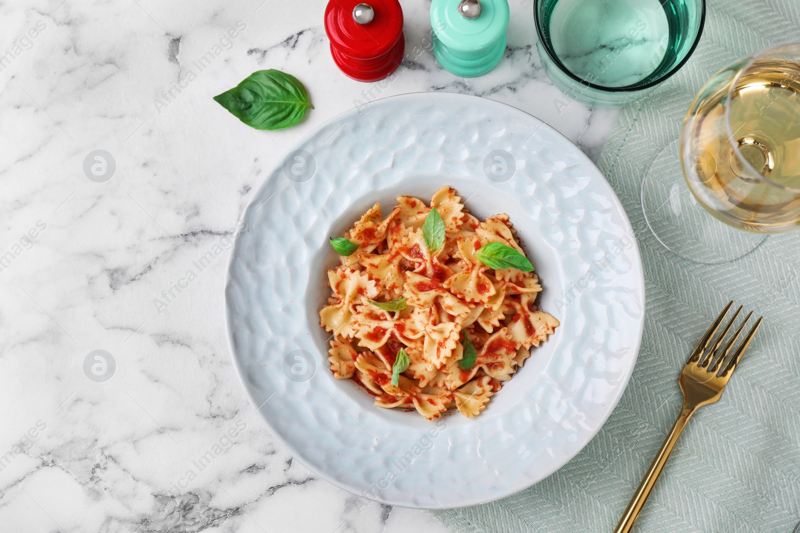 Photo of Flat lay composition with tasty pasta on white marble table