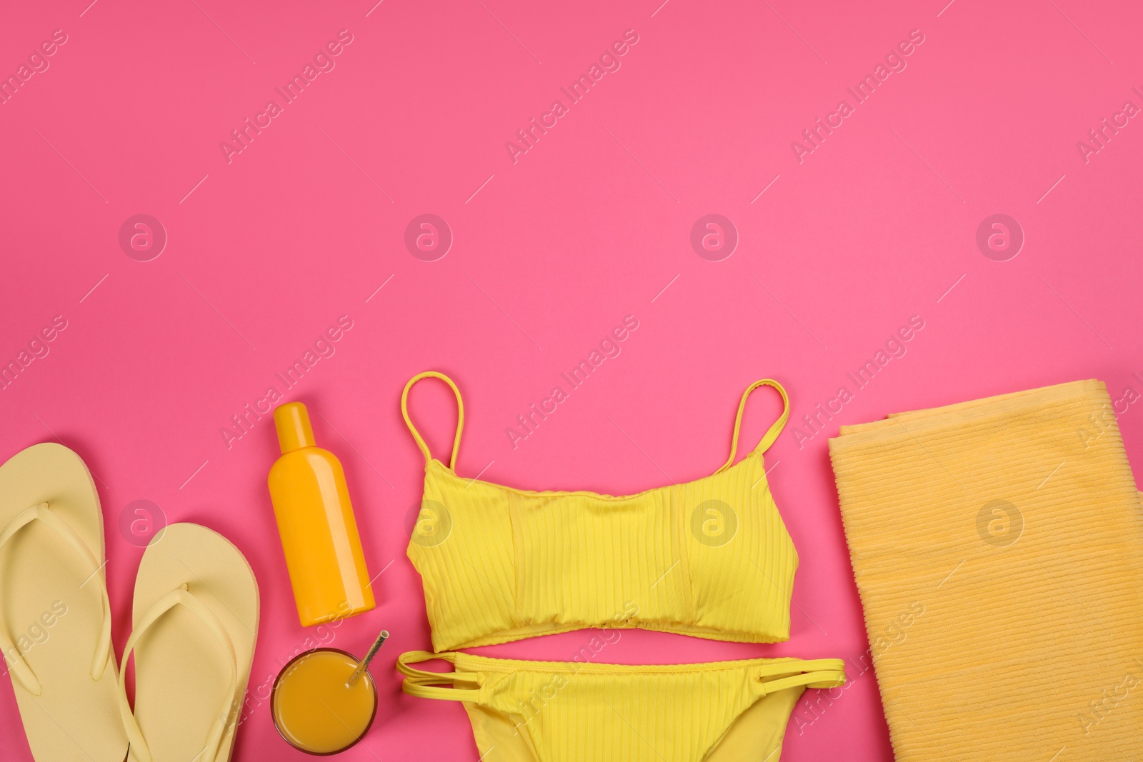 Photo of Flat lay composition with beach objects on pink background, space for text