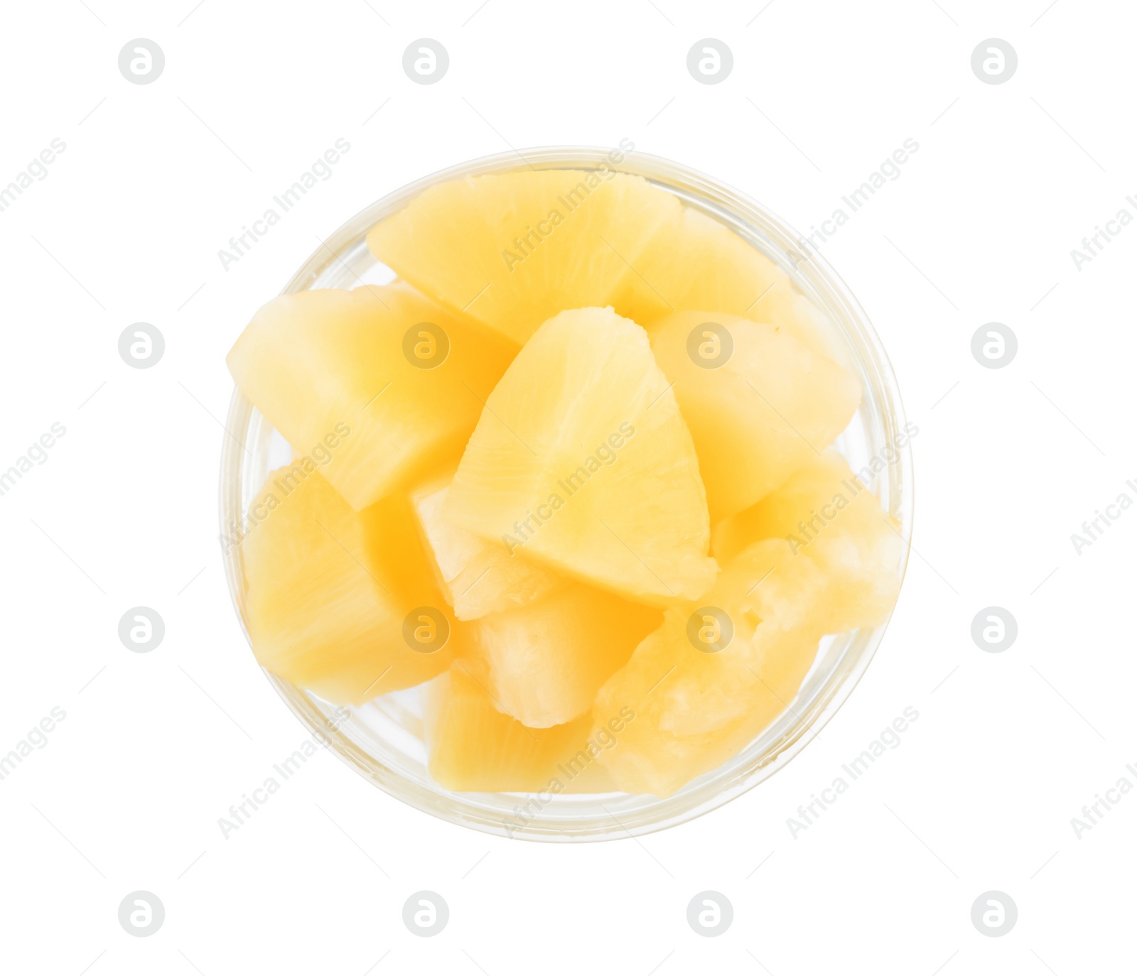 Photo of Pieces of delicious sweet canned pineapple in glass bowl on white background, top view