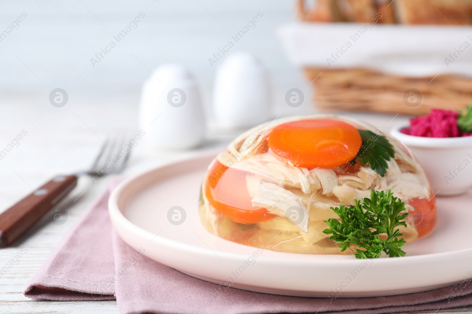 Photo of Delicious chicken aspic served on table, closeup