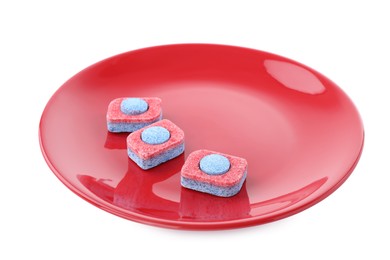 Photo of Red plate with many dishwasher detergent tablets on white background