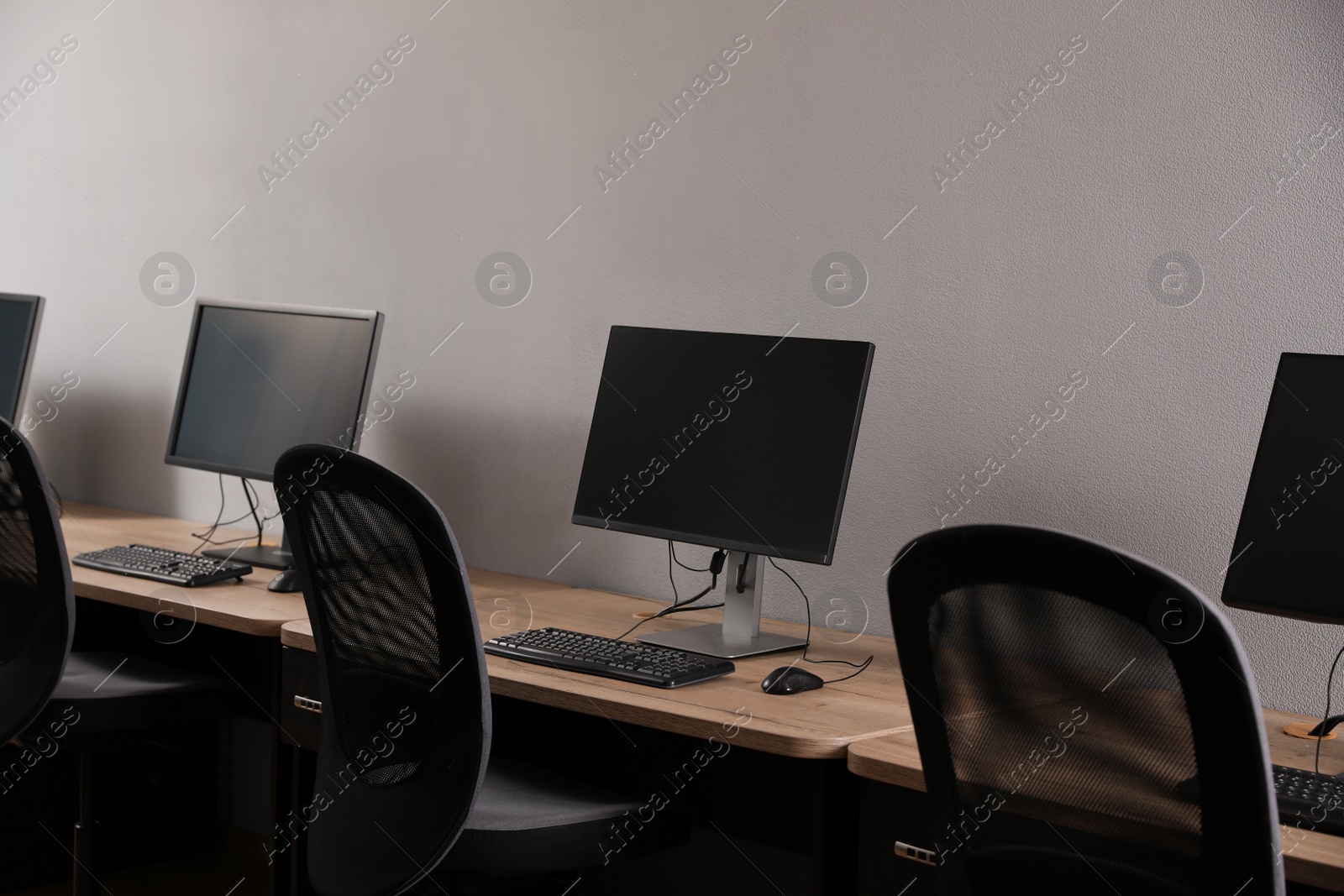 Photo of Many modern computers in open space office