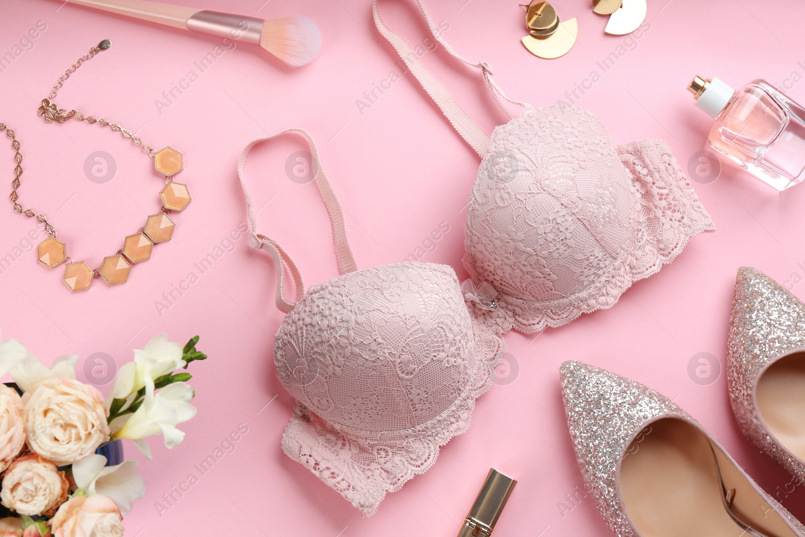 Photo of Flat lay composition with sexy women's underwear on pink background