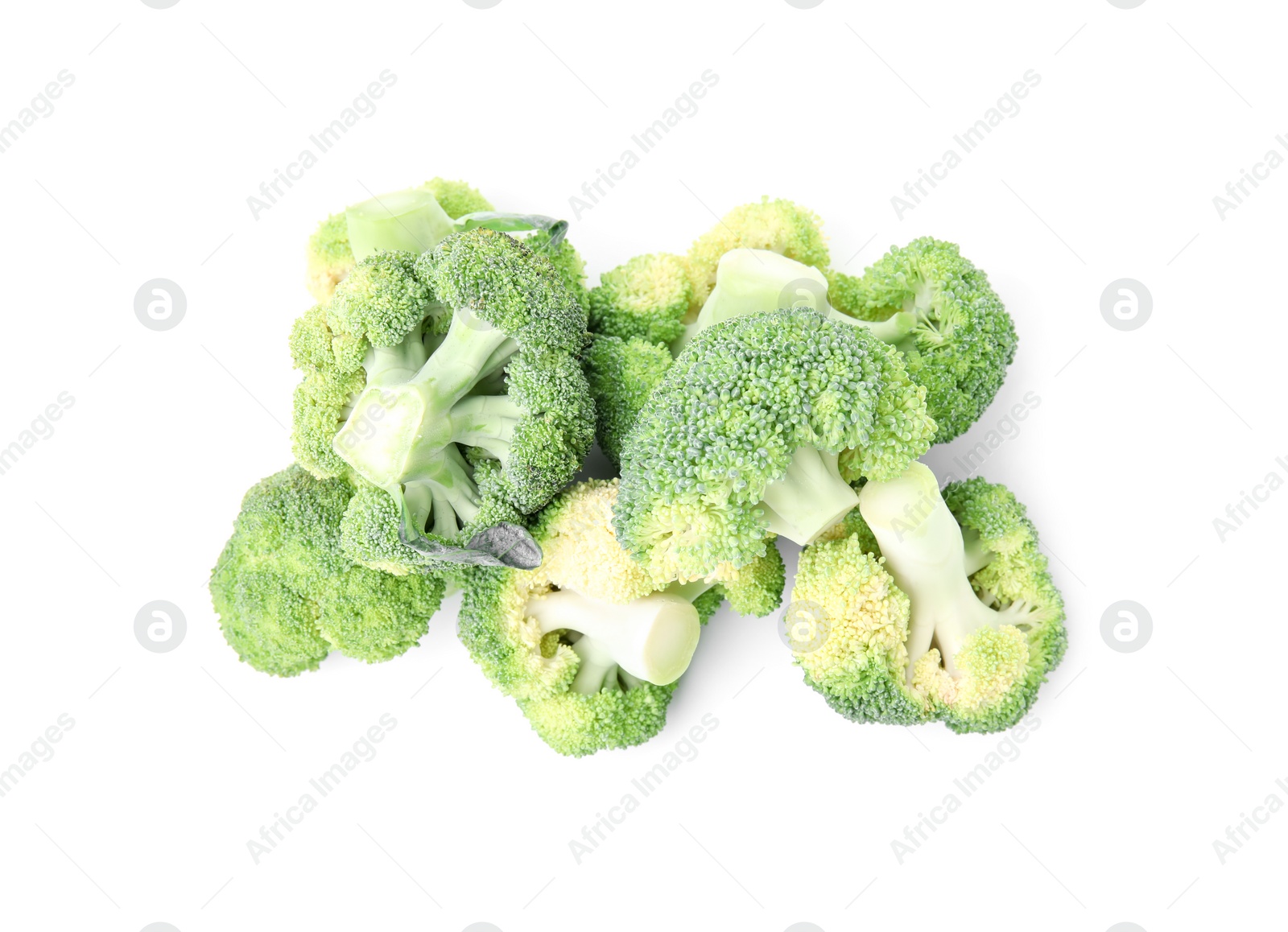 Photo of Pile of fresh raw green broccoli isolated on white, top view