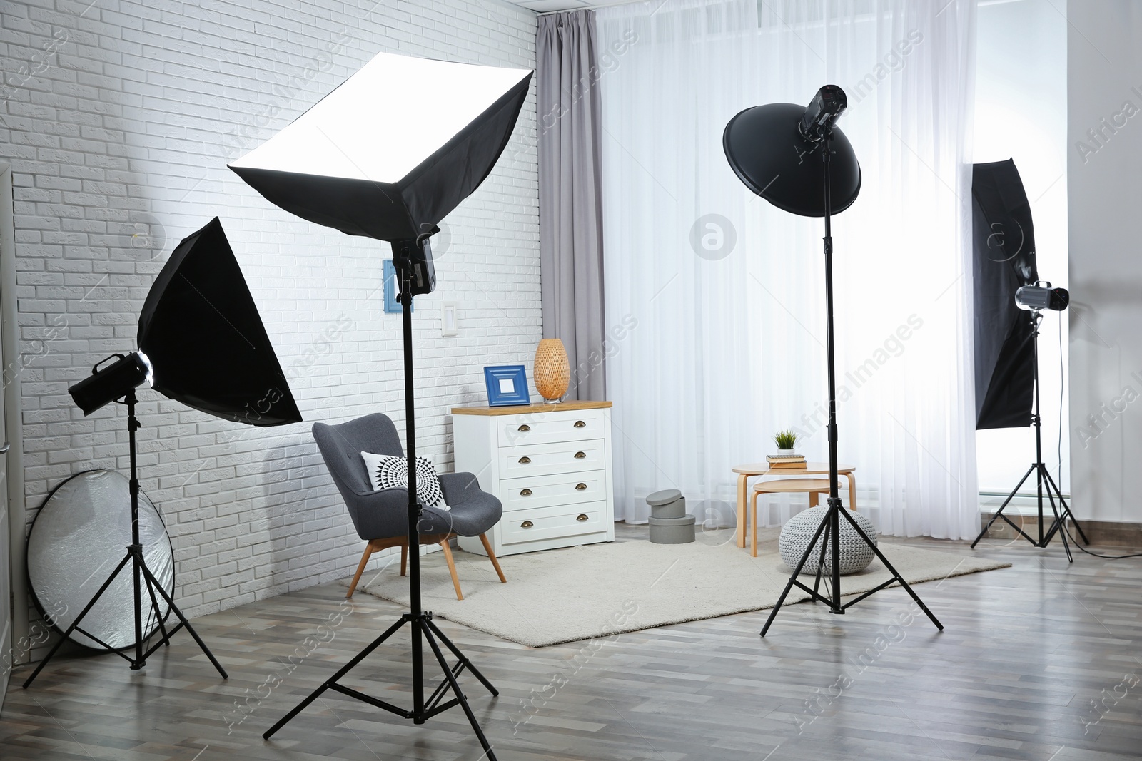 Photo of Example of living room interior design and professional equipment in photo studio