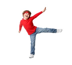 Happy little boy dancing on white background