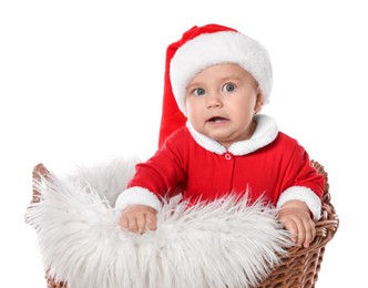 Cute baby in wicker basket on white background. Christmas celebration