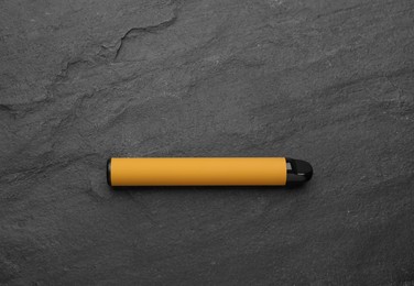 Photo of Disposable electronic smoking device on black background, top view