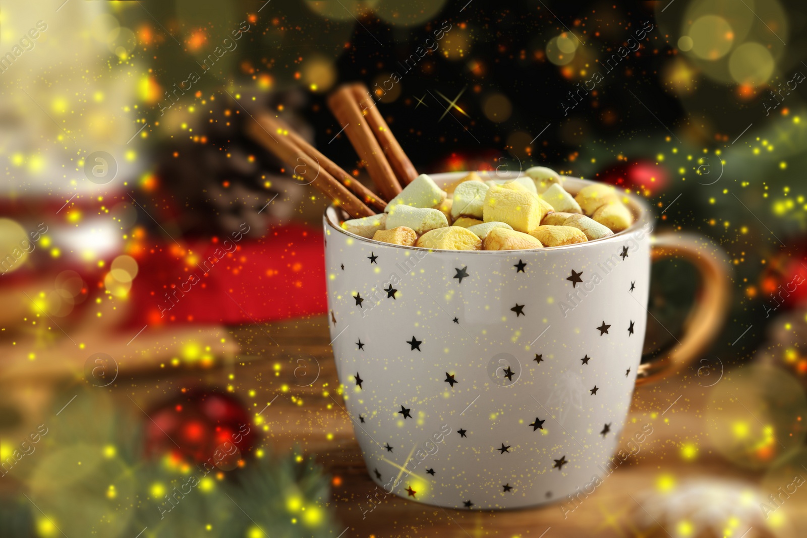 Image of Delicious hot chocolate with marshmallows, cinnamon and Christmas decor on wooden table. Bokeh effect