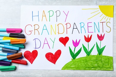 Photo of Beautiful drawing on light table, flat lay. Happy Grandparents Day