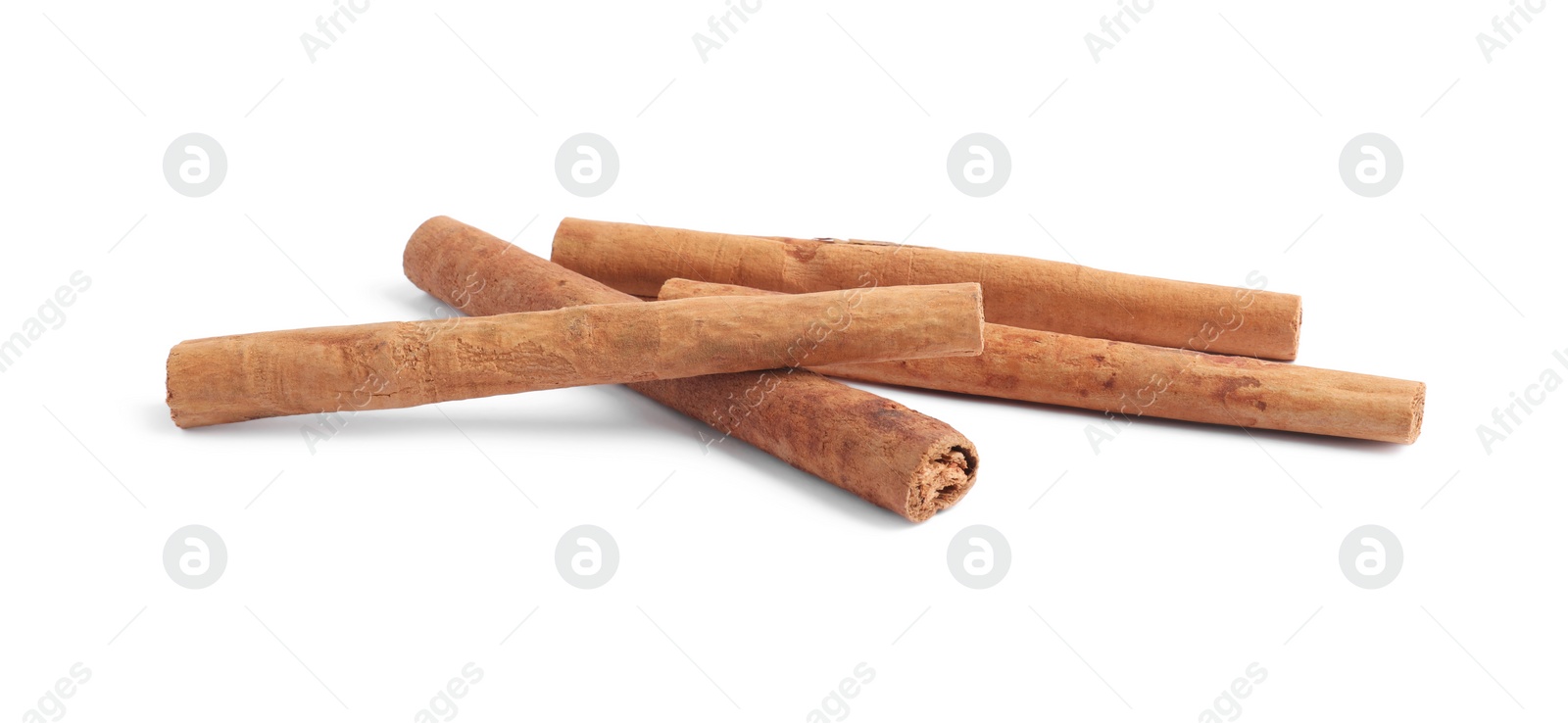 Photo of Dry aromatic cinnamon sticks isolated on white