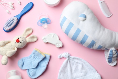 Photo of Flat lay composition with baby accessories and toys on color background