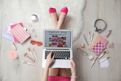Photo of Fashion blogger with laptop on floor, top view