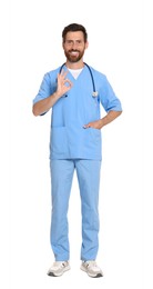 Photo of Full length portrait of doctor in scrubs on white background