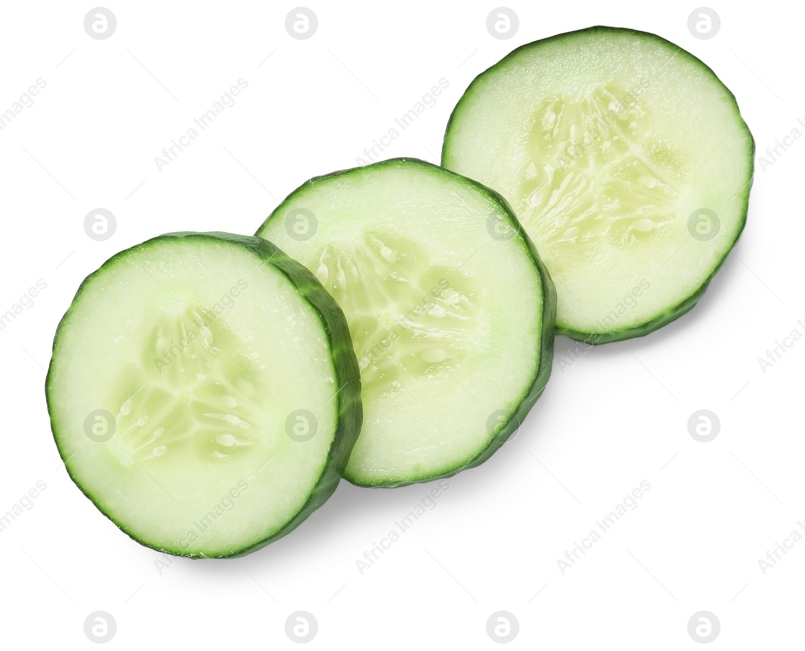 Photo of Slices of fresh cucumber isolated on white, top view