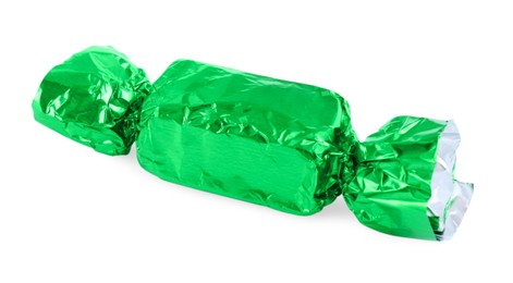 Photo of Tasty candy in green wrapper isolated on white