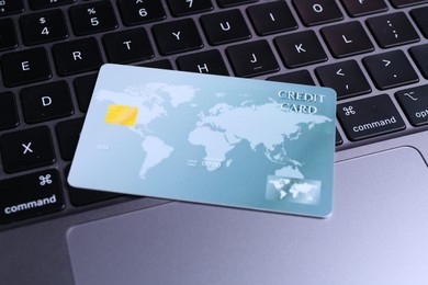 One plastic credit card on modern laptop