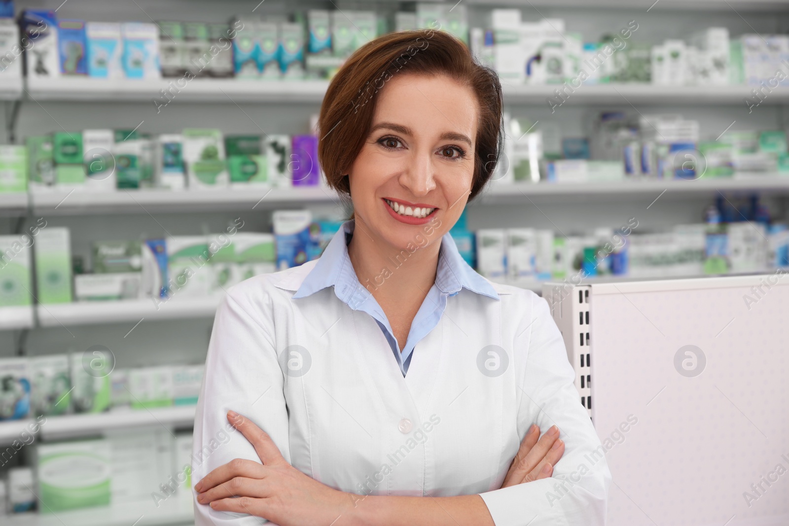 Photo of Portrait of professional pharmacist in modern drugstore