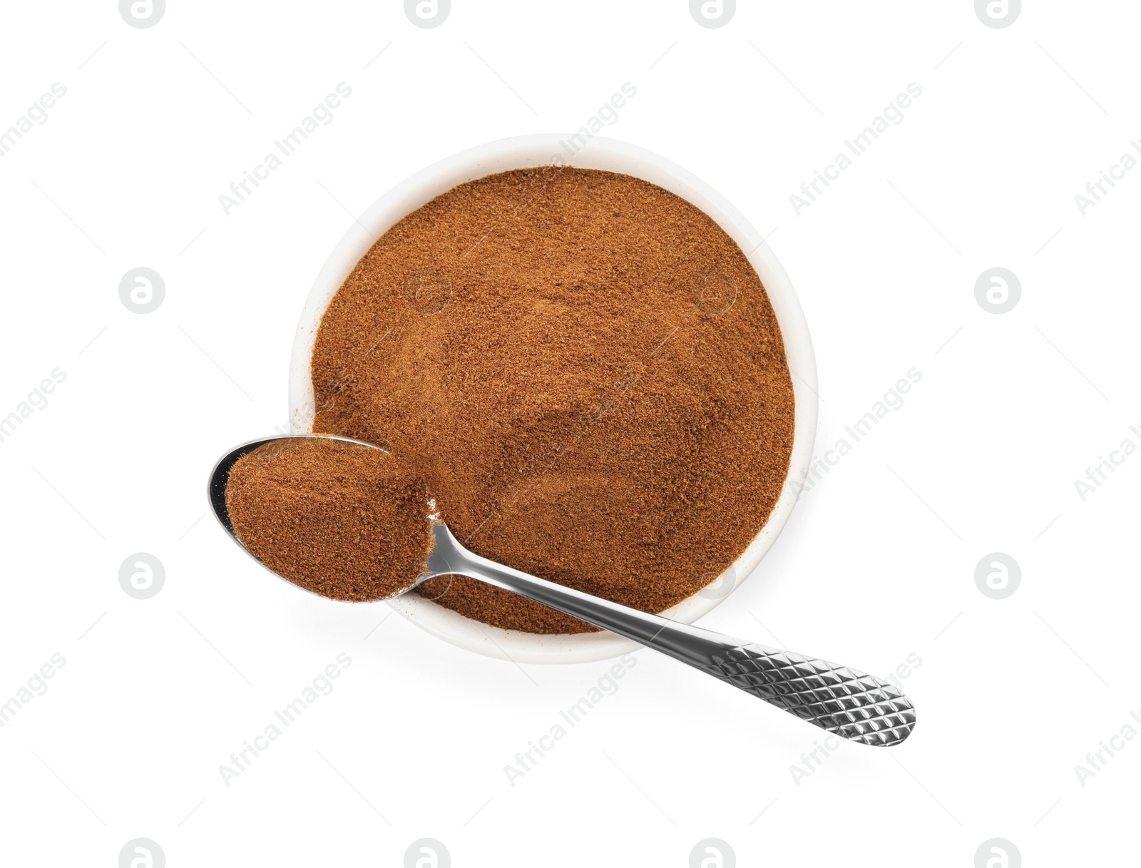 Photo of Plate and spoon of chicory powder on white background, top view