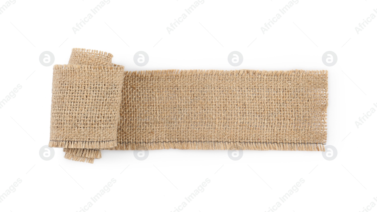 Photo of Unrolled burlap ribbon isolated on white, top view