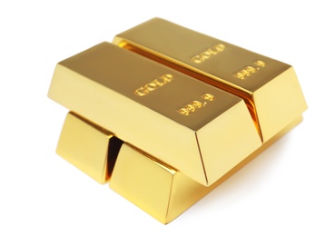 Precious shiny gold bars on white background