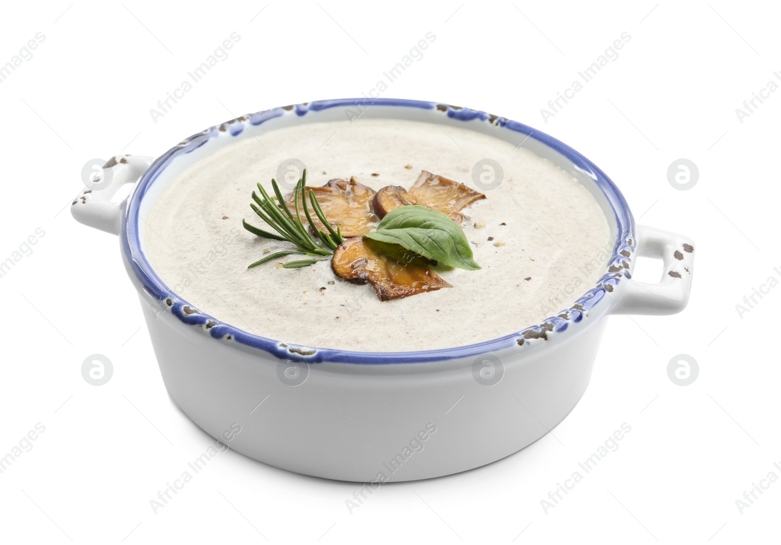 Photo of Fresh homemade mushroom soup in ceramic pot isolated on white