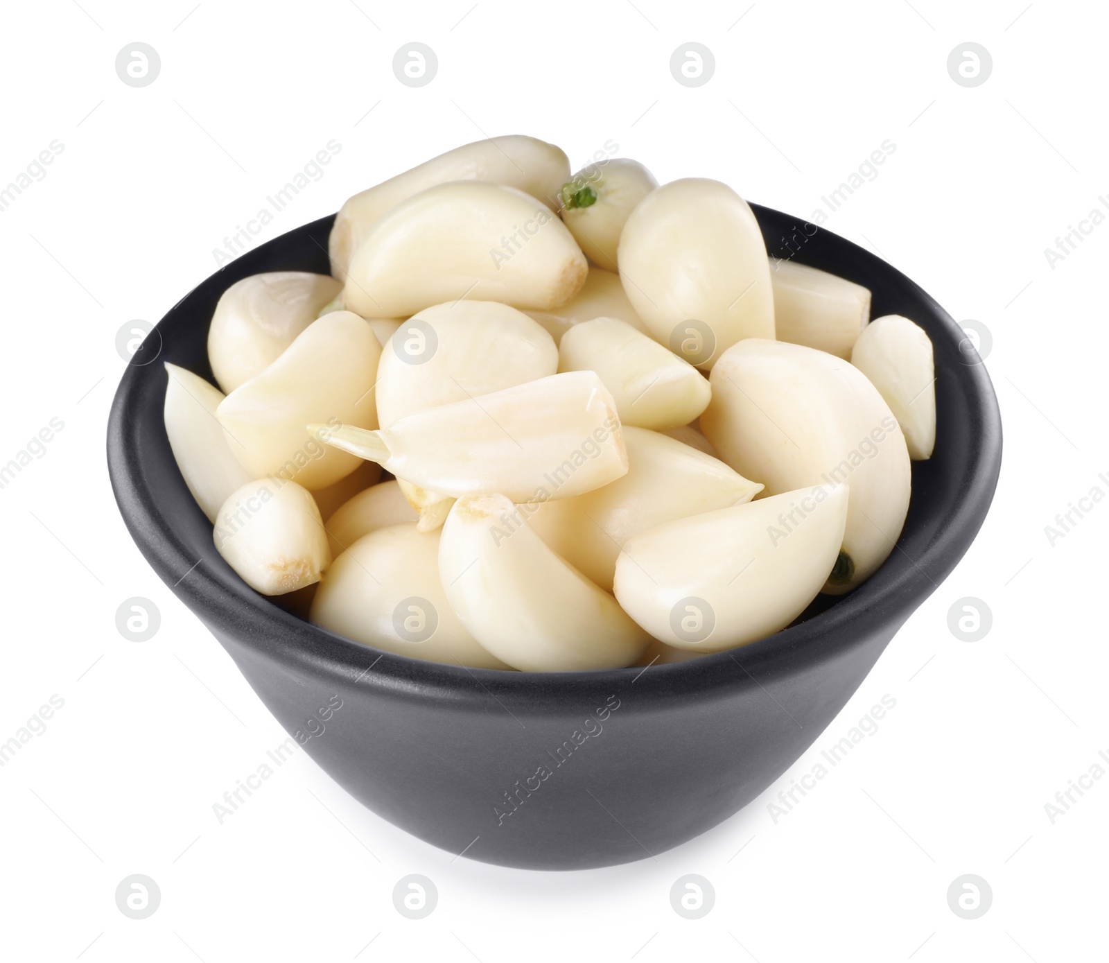 Photo of Peeled cloves of fresh garlic in bowl isolated on white