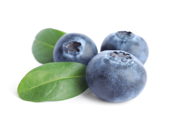 Fresh ripe blueberries with leaves on white background