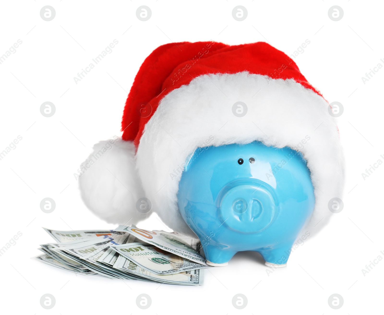 Photo of Piggy bank with Santa hat and dollar banknotes on white background