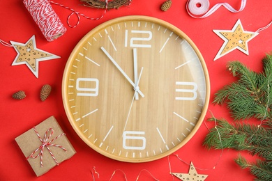 Photo of Flat lay composition with clock and decorations on color background. Christmas countdown