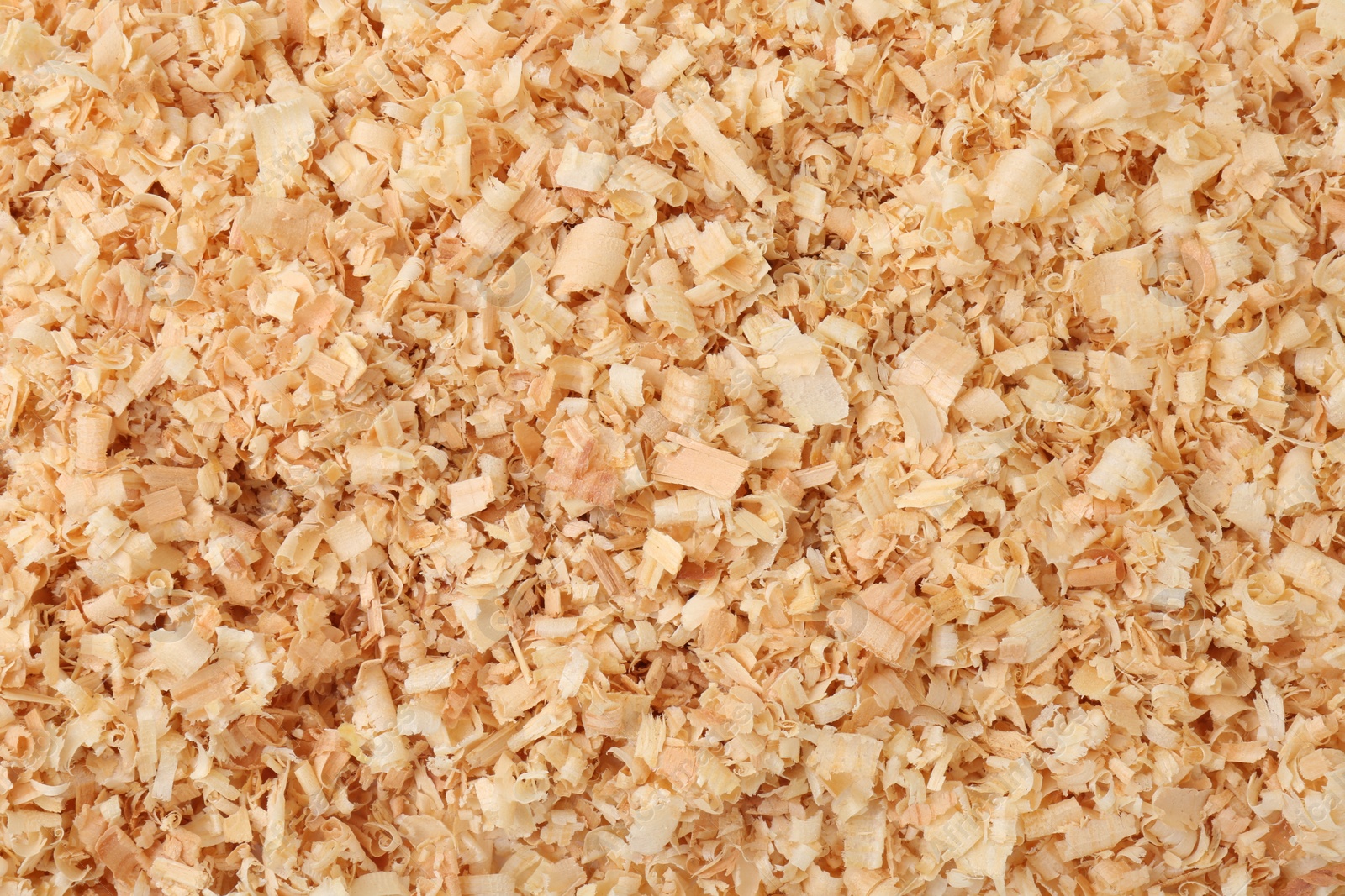 Photo of Pile of natural sawdust as background, top view