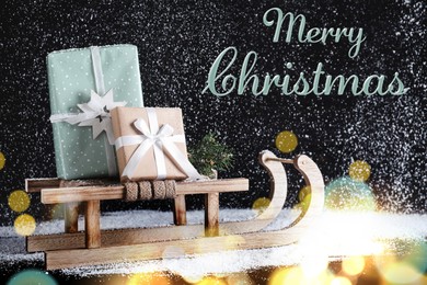 Image of Merry Christmas. Sleigh with gift boxes under snowfall