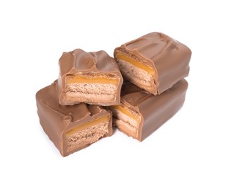 Pieces of tasty chocolate bars with nougat on white background