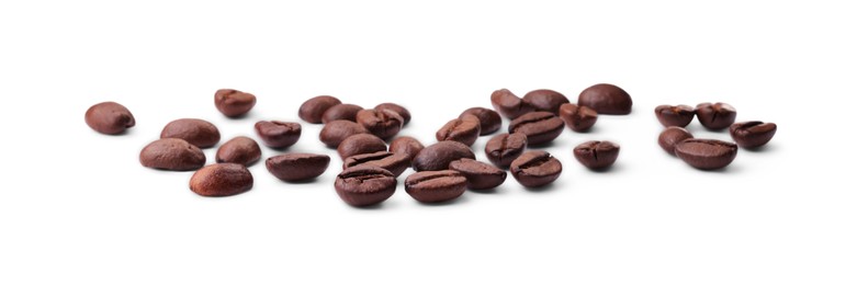 Photo of Many roasted coffee beans isolated on white