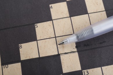 Pen on blank crossword, top view. Space for text