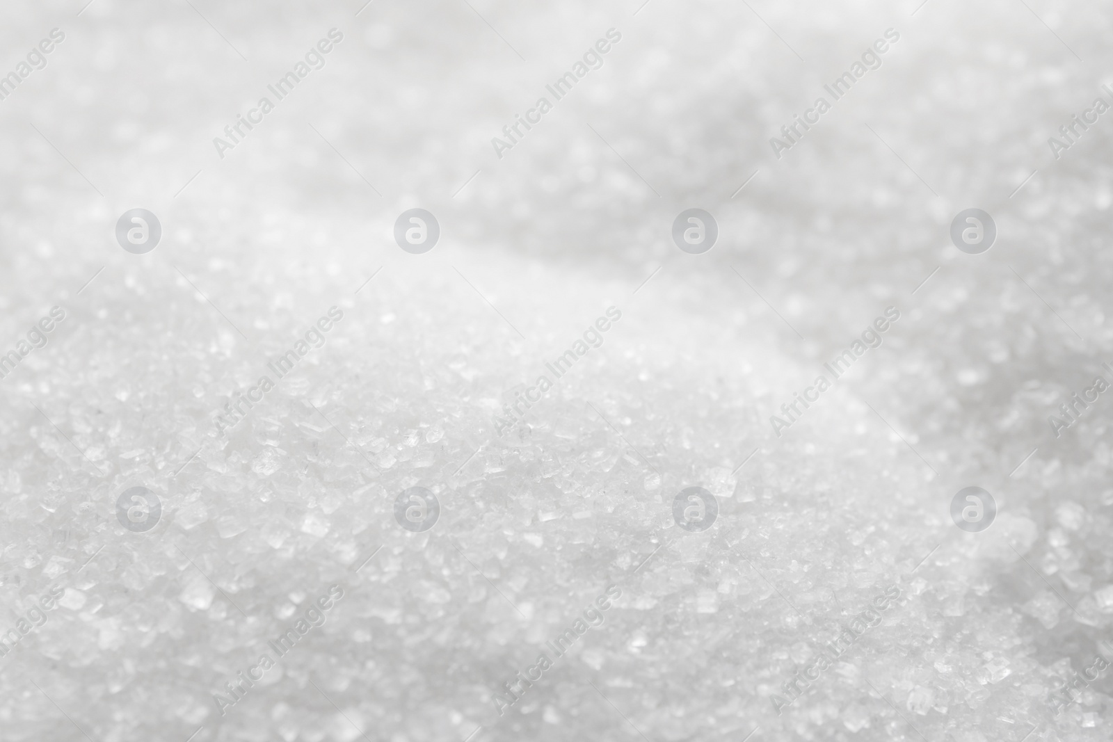 Photo of Sweet granulated sugar as background, closeup view