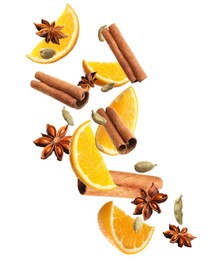 Image of Pieces of fresh orange, aromatic anise stars, cinnamon and cardamom falling on white background