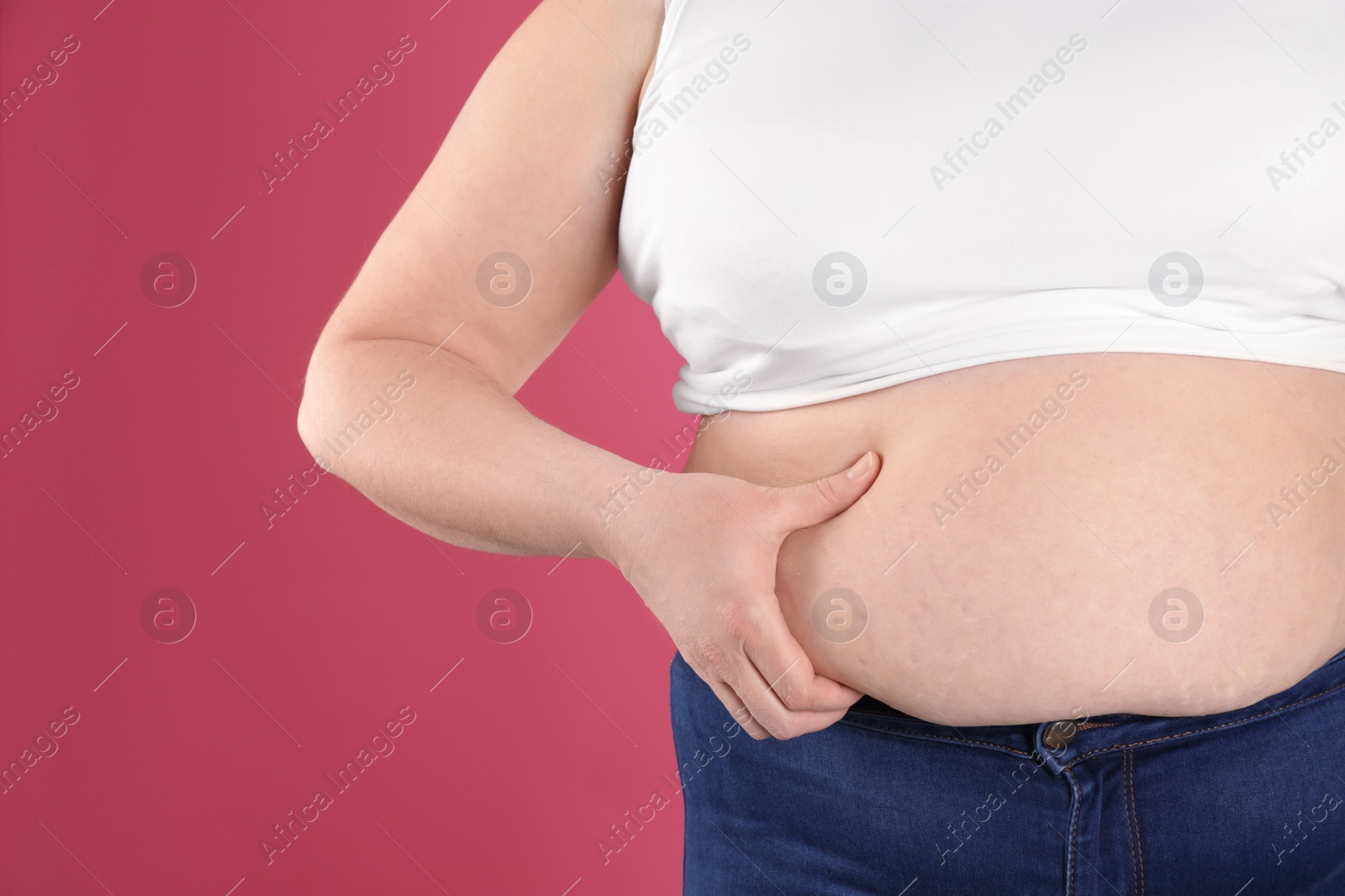 Photo of Overweight woman on color background, closeup. Space for text