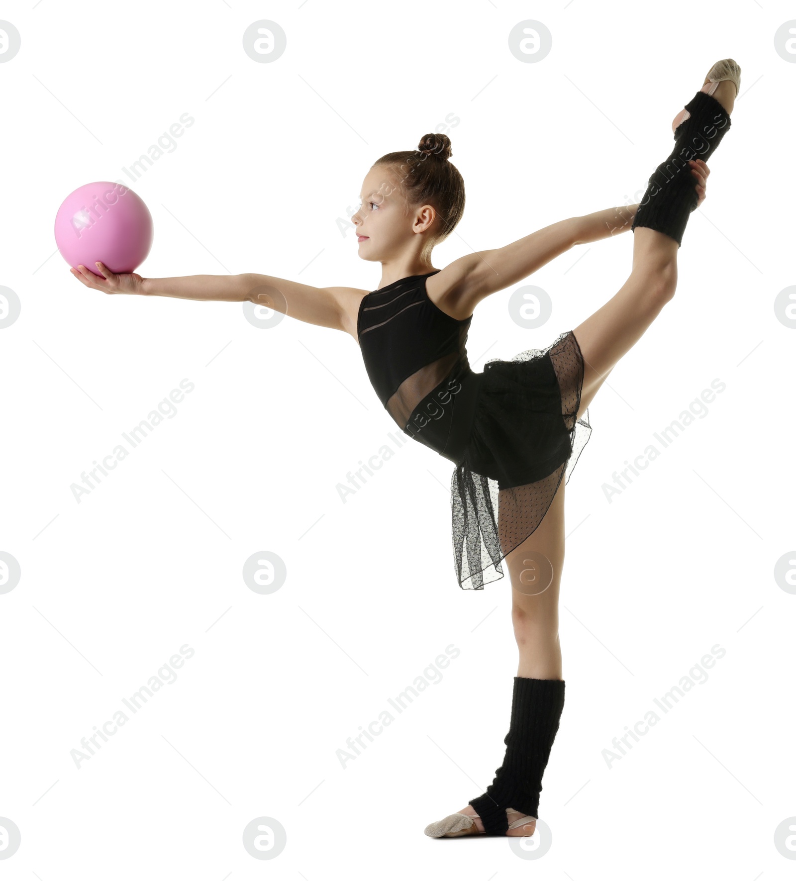 Photo of Cute little gymnast with ball doing standing split on white background