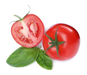 Fresh green basil leaves with cut and whole tomatoes on white background, top view