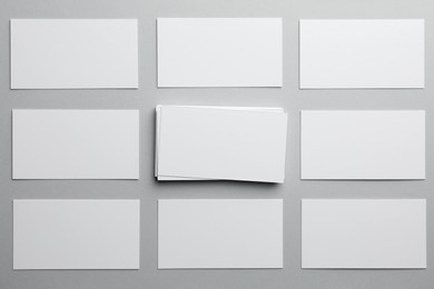 Photo of Blank business cards on light gray background, flat lay. Mockup for design