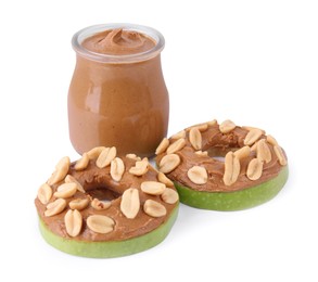 Photo of Slices of fresh apple with peanut butter and nuts isolated on white