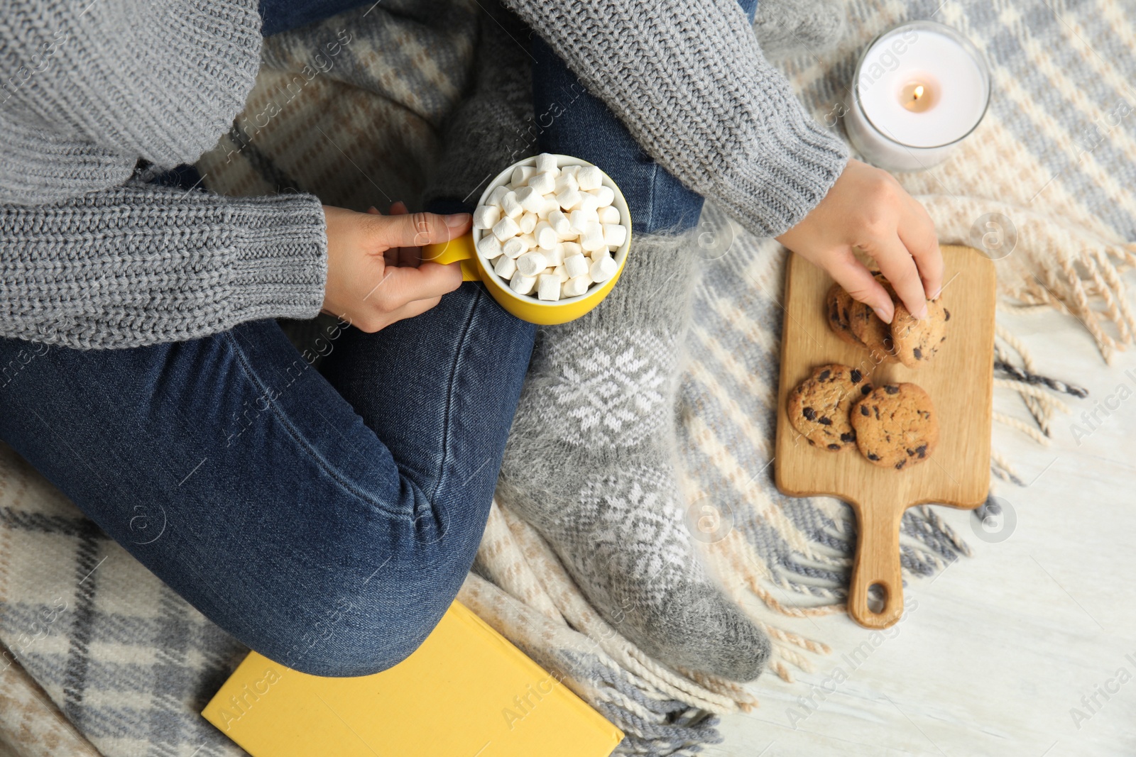 Photo of Woman with cup of hot cocoa, above view. Winter drink