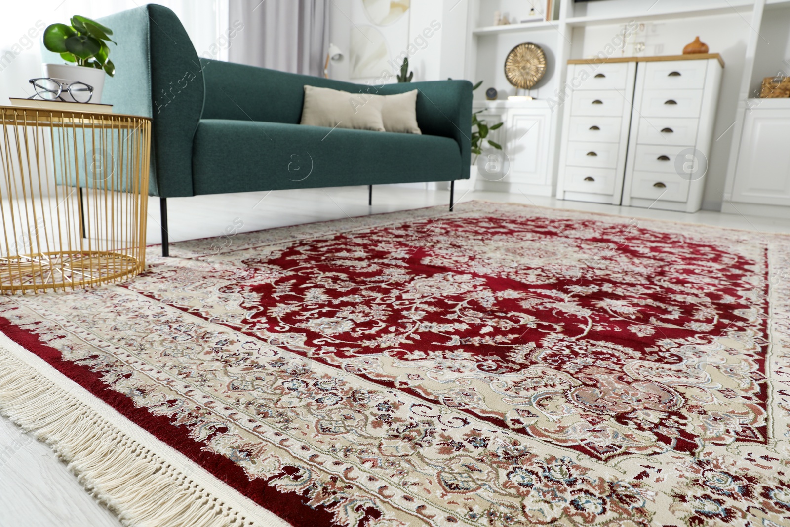 Photo of Stylish living room with beautiful carpet and furniture, closeup. Interior design