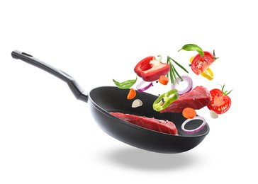 Tasty fresh ingredients and frying pan on white background