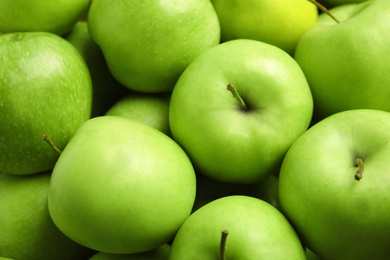 Photo of Fresh ripe green apples as background, closeup view