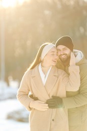 Beautiful young couple enjoying winter day outdoors